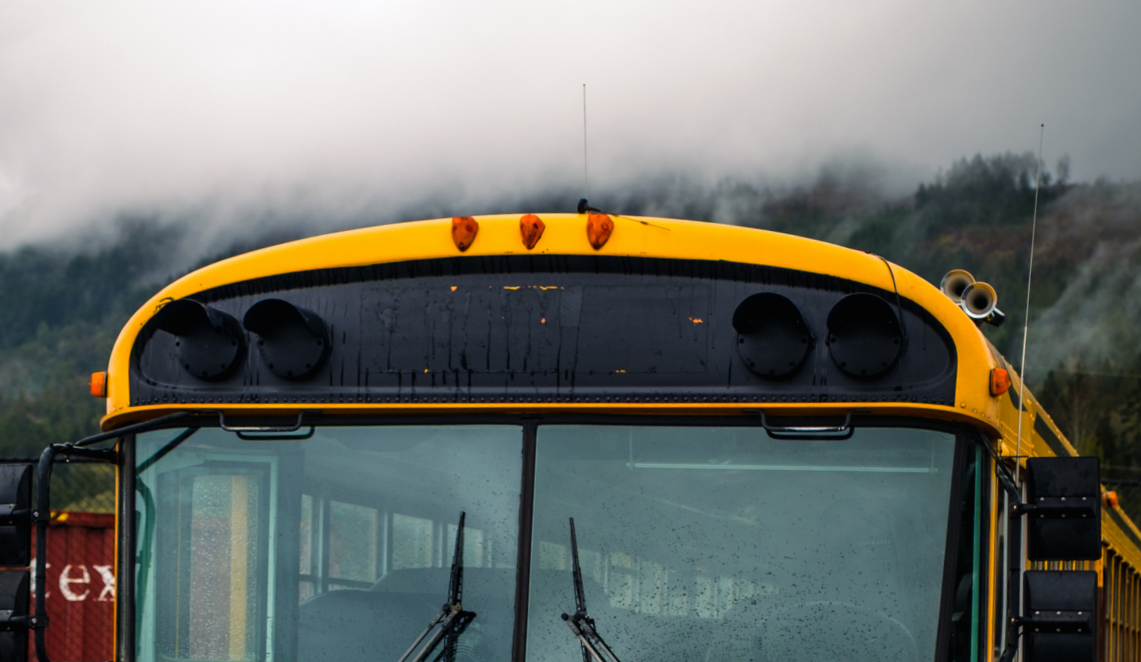 banner for reviews section with fog and bus top